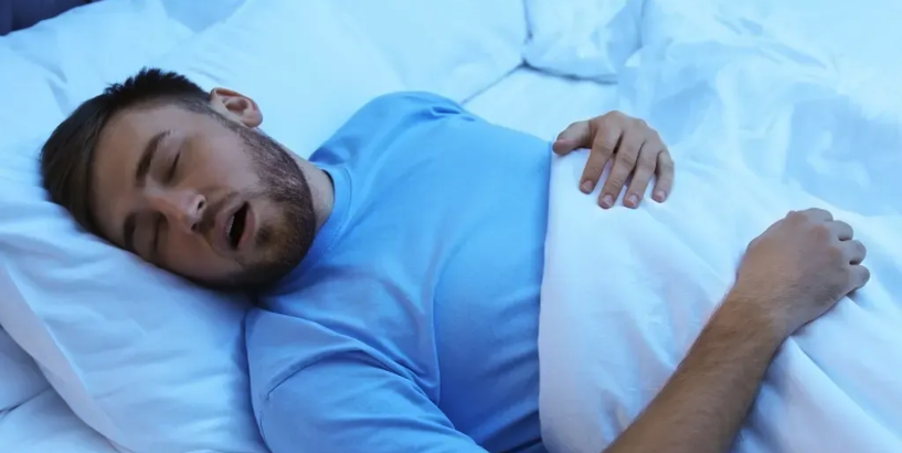 Man snoring while sleeping
