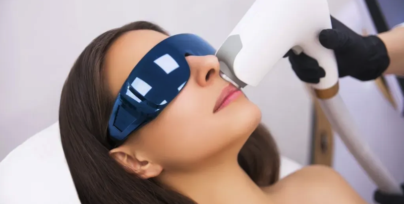 Woman receiving laser hair removal treatment